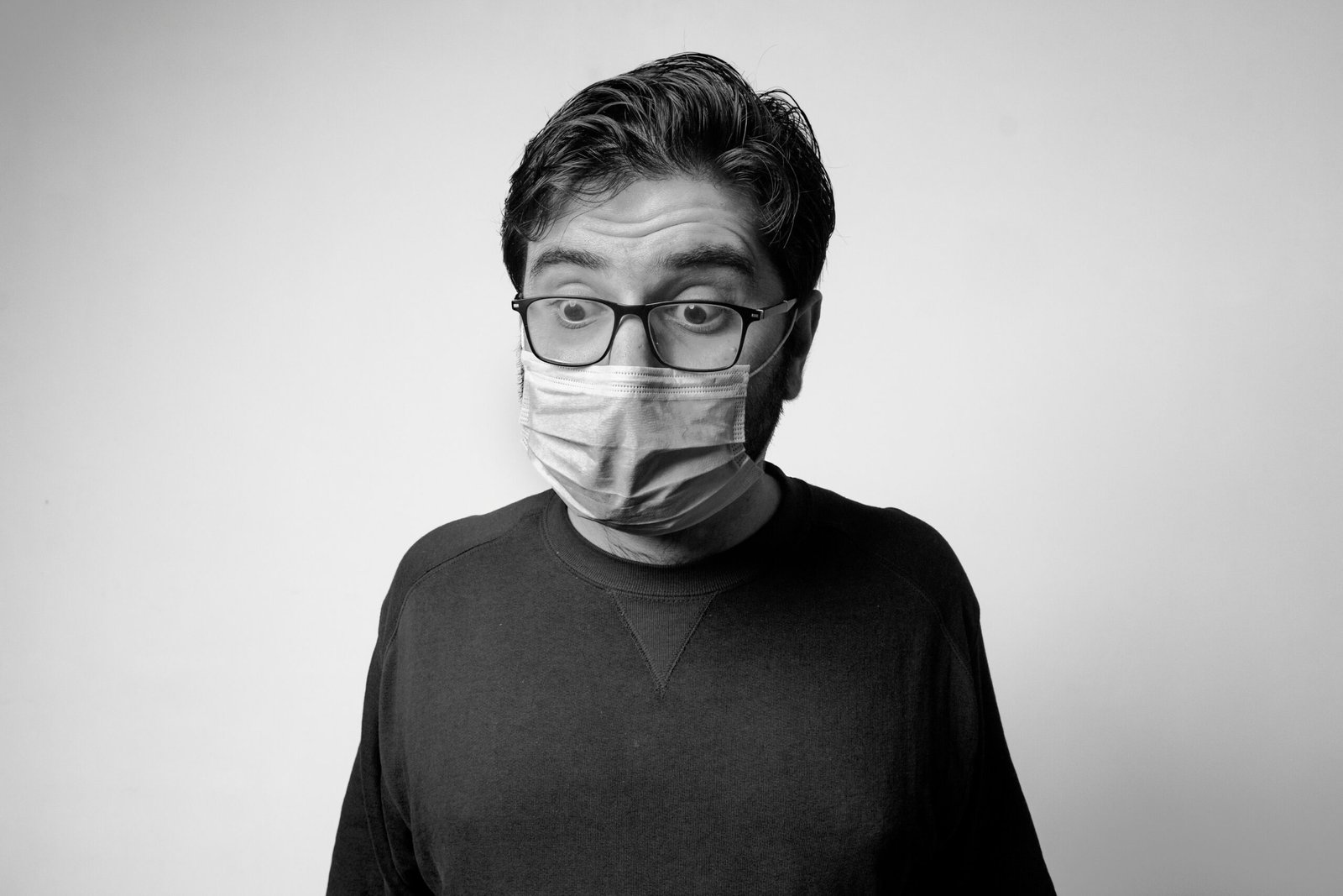 man in black turtleneck shirt wearing eyeglasses